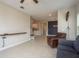 Bright living room featuring tile floors, neutral walls, open layout, blending comfort and style in a modern setting at 13387 Crest Lake Dr, Hudson, FL 34669