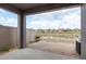 Covered patio featuring a brick floor and a view of a pond at 13387 Crest Lake Dr, Hudson, FL 34669