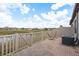 Outdoor patio features a brick floor and a view of a pond at 13387 Crest Lake Dr, Hudson, FL 34669