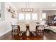 Elegant dining room features a wood table and six chairs at 14015 Kingfisher Glen Dr, Lithia, FL 33547