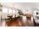 Bright dining room with hardwood floors and modern light fixture at 14015 Kingfisher Glen Dr, Lithia, FL 33547