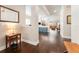 Bright and airy entryway with hardwood floors and views to the living area at 14015 Kingfisher Glen Dr, Lithia, FL 33547