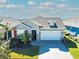 Attractive single-story home with a two-car garage and landscaped yard at 14015 Kingfisher Glen Dr, Lithia, FL 33547