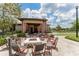 Community fire pit with seating for residents at 14015 Kingfisher Glen Dr, Lithia, FL 33547