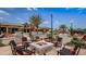 Community fire pit with seating near pool at 14015 Kingfisher Glen Dr, Lithia, FL 33547