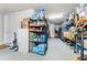 Garage interior with various storage solutions at 14015 Kingfisher Glen Dr, Lithia, FL 33547