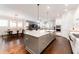 Modern kitchen boasts a large island, stainless steel appliances, and white cabinets at 14015 Kingfisher Glen Dr, Lithia, FL 33547