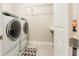 Bright laundry room with washer, dryer, and extra counter space at 14015 Kingfisher Glen Dr, Lithia, FL 33547