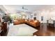 Relaxing living room with leather sectional and access to backyard at 14015 Kingfisher Glen Dr, Lithia, FL 33547