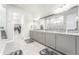 Large main bathroom with double vanity, granite countertops, and a walk-in closet at 14015 Kingfisher Glen Dr, Lithia, FL 33547