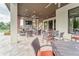 Covered patio with seating and a fireplace at 14015 Kingfisher Glen Dr, Lithia, FL 33547