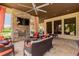 Relaxing outdoor patio with fireplace and seating at 14015 Kingfisher Glen Dr, Lithia, FL 33547