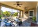 Relaxing screened patio featuring comfortable seating and ceiling fans at 14015 Kingfisher Glen Dr, Lithia, FL 33547