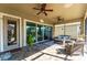 Enjoyable screened patio with seating and backyard access at 14015 Kingfisher Glen Dr, Lithia, FL 33547