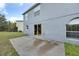 Private backyard with patio and grassy area at 1703 Alhambra Crest Dr, Ruskin, FL 33570