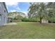 Spacious backyard with shed and large tree at 1703 Alhambra Crest Dr, Ruskin, FL 33570