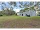 Large backyard with mature trees at 1703 Alhambra Crest Dr, Ruskin, FL 33570
