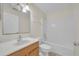 Simple bathroom with tub and wood vanity at 1703 Alhambra Crest Dr, Ruskin, FL 33570