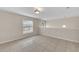 Well-lit bedroom showcasing tile flooring and a window with blinds at 1703 Alhambra Crest Dr, Ruskin, FL 33570