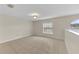 Bright bedroom featuring tile flooring and a large window with blinds at 1703 Alhambra Crest Dr, Ruskin, FL 33570