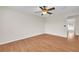 Bright bedroom with ceiling fan and wood floors at 1703 Alhambra Crest Dr, Ruskin, FL 33570