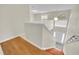 Clean entryway with stairs leading to the second floor and wood-look flooring at 1703 Alhambra Crest Dr, Ruskin, FL 33570