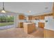 Open kitchen with island and white appliances at 1703 Alhambra Crest Dr, Ruskin, FL 33570