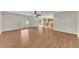 Spacious living room with wood floors and kitchen view at 1703 Alhambra Crest Dr, Ruskin, FL 33570