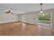 Living room features wood floors, sliding doors, and a ceiling fan at 1703 Alhambra Crest Dr, Ruskin, FL 33570