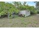 White storage shed with chain link fence at 1703 Alhambra Crest Dr, Ruskin, FL 33570