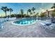 Inviting kidney-shaped pool with lounge chairs at 18325 Gulf Blvd # 405, Redington Shores, FL 33708