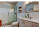 Bright bathroom with a glass-enclosed shower, white vanity, and stylish fixtures at 2284 Philippine Dr # 71, Clearwater, FL 33763