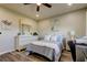 Bright bedroom with a ceiling fan, a dresser, and neutral wall paint at 2284 Philippine Dr # 71, Clearwater, FL 33763