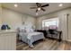 Charming bedroom with a ceiling fan, a desk, and ample natural light from the window at 2284 Philippine Dr # 71, Clearwater, FL 33763