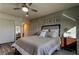 Cozy bedroom with a ceiling fan, starfish decor, and warm, inviting neutral tones at 2284 Philippine Dr # 71, Clearwater, FL 33763