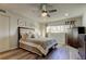 Bedroom featuring a ceiling fan, a window with natural light, and dark wood furniture at 2284 Philippine Dr # 71, Clearwater, FL 33763