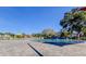 Large community pool area with plenty of seating and shade structures at 2284 Philippine Dr # 71, Clearwater, FL 33763