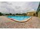 Well-maintained community pool featuring ample seating and a convenient access ramp at 2284 Philippine Dr # 71, Clearwater, FL 33763