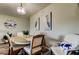 Comfortable dining area with upholstered chairs and a decorative wall clock at 2284 Philippine Dr # 71, Clearwater, FL 33763