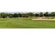 Expansive green golf course with mature trees and a sand trap at 2284 Philippine Dr # 71, Clearwater, FL 33763