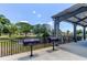 Outdoor grilling area with community grills overlooking a tranquil pond, perfect for barbecues and cookouts at 2284 Philippine Dr # 71, Clearwater, FL 33763