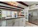 Kitchen featuring island with granite countertop, stainless steel refrigerator, and ample natural light at 2284 Philippine Dr # 71, Clearwater, FL 33763