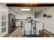 Bright kitchen with stainless steel appliances, white cabinets, and a center island with bar seating at 2284 Philippine Dr # 71, Clearwater, FL 33763
