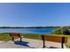 Scenic lake view featuring benches for enjoying the tranquil surroundings and picturesque scenery at 2284 Philippine Dr # 71, Clearwater, FL 33763