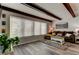 Inviting living room showcasing beamed ceilings, a comfortable sofa, and large windows for ample natural light at 2284 Philippine Dr # 71, Clearwater, FL 33763