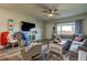 Comfortable living room features a plush sectional sofa, natural light, and stylish decor elements at 2284 Philippine Dr # 71, Clearwater, FL 33763