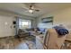 Inviting living room features a plush sectional sofa, natural light, and views of a beautiful landscape at 2284 Philippine Dr # 71, Clearwater, FL 33763