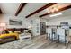 Open living space with beamed ceilings connects the cozy living room to a modern kitchen and dining area at 2284 Philippine Dr # 71, Clearwater, FL 33763