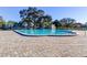 Large community pool surrounded by well-maintained landscaping and plenty of seating at 2284 Philippine Dr # 71, Clearwater, FL 33763