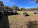 Front yard with golf cart and lawnmower at 26418 Dayflower Blvd, Wesley Chapel, FL 33544